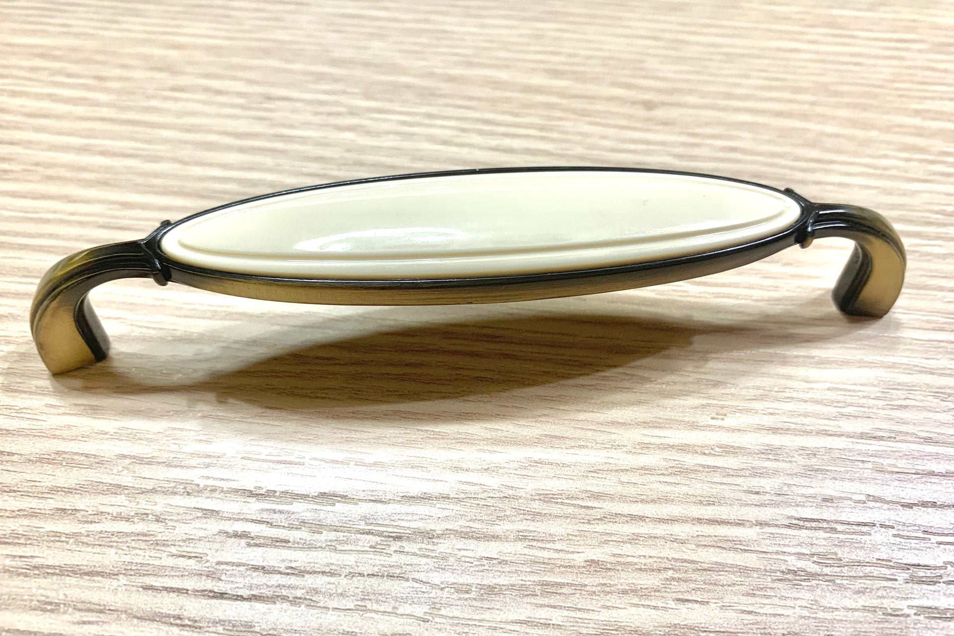 Poignée de meuble en cuir et porcelaine 128mm entraxe