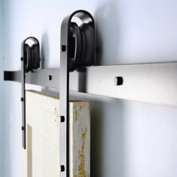 Guías y kits para puertas correderas