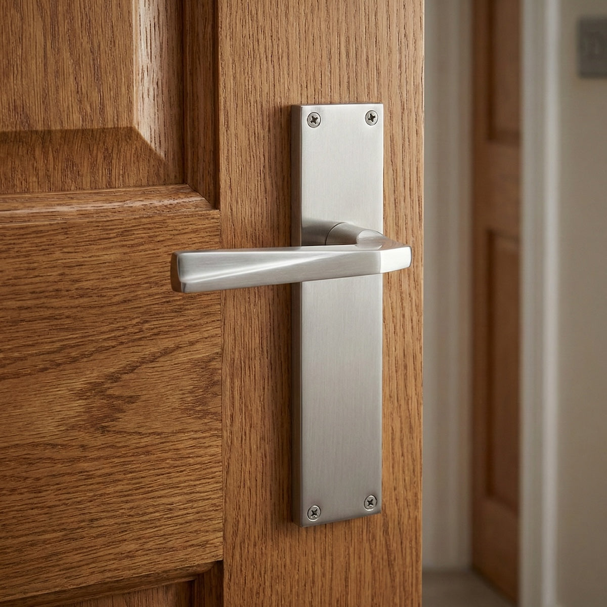 Béquille avec plaque rectangulaire en zamak finition nickel satiné pour portes modèle '208'